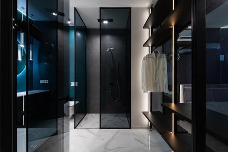 Modern black glass bathroom with closet 